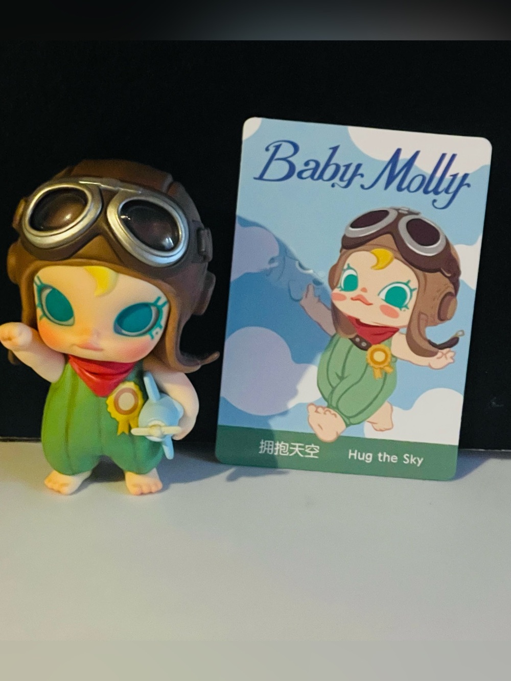 Baby Molly “Hug the Sky' Green Pilot Figure – Collectible